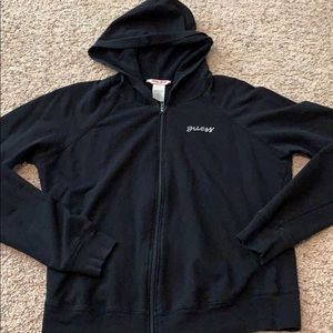 Black hooded zip up Guess sweater.